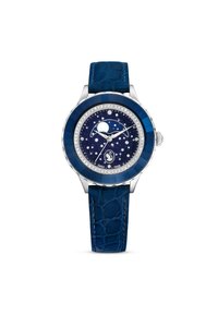 Zegarek w srebrnym odcieniu z niebieskim paskiem z krokodylej skóry. Posiada tarczę w stylu gwiaździstej nocy z wskaźnikiem fazy Księżyca oraz kryształowymi akcentami.