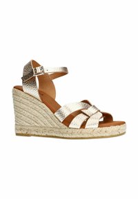Metallic gold wedge sandals with crisscross straps, jute-wrapped base, open toe, and adjustable ankle strap. Flat sole.