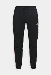 Pantalones de chándal negros con cintura con cordón, que presentan paneles laterales rosas y un pequeño logo en el frente. Material suave y diseño ajustado.