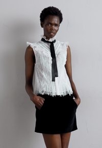 Alice + Olivia Mini skirts  - black