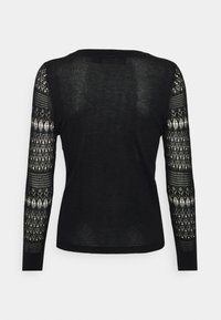 Vero Moda Petite Stickad tröja - black