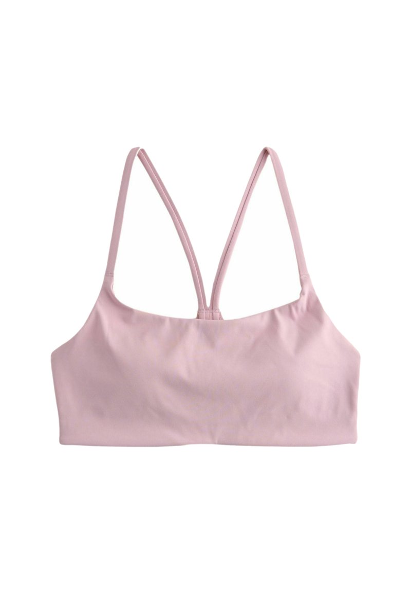 Roosa spordirinnahoidja, millel on õhukesed reguleeritavad rihmad ja mis on valmistatud siledast kangast. Ees on lihtsa ja puhast lõikega, ilma täiendava riistvara või mustriteta.