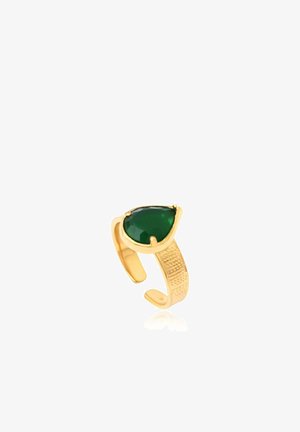 Bague réglable en or avec une bande texturée et une grande pierre précieuse verte en forme de poire sertie de griffes.