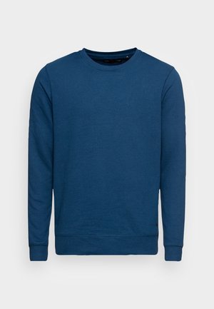 Sudadera lisa de manga larga con cuello redondo en azul oscuro sólido, con puños y dobladillo acanalados, presentada sobre un fondo neutral.