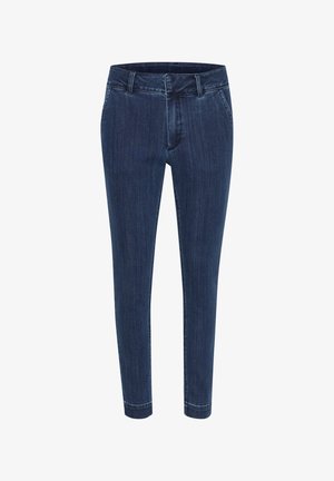 Mørkeblå denimjeans med en tætsiddende design. Har en mellemhøj talje, forlommer og synlige sting langs sømmene.