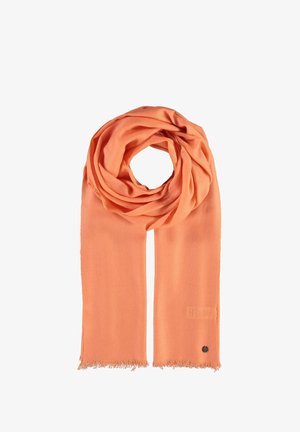 Écharpe couleur corail-orange en tissu doux, avec des extrémités frangées et un design en boucle. Comprend un petit logo près de la base.