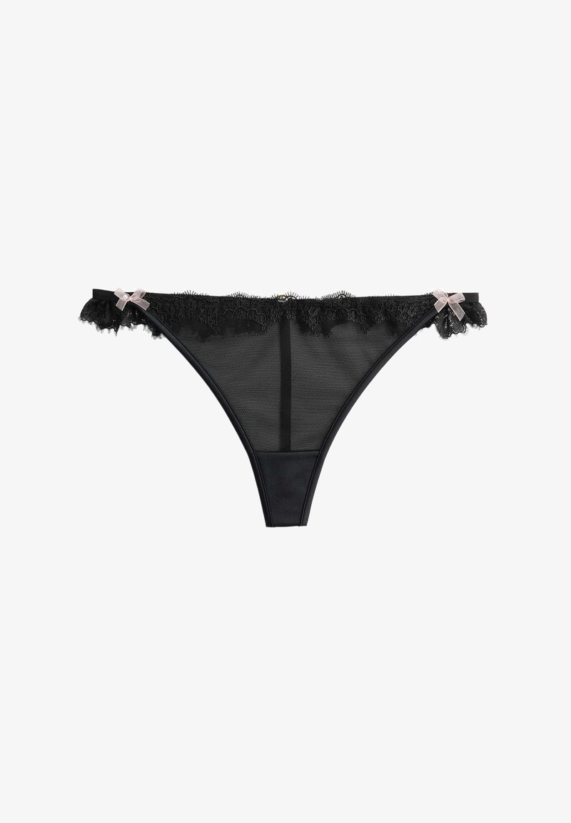 Thong en dentelle noire avec un corps en maille transparente, bordure en dentelle décorative à la taille et deux petits nœuds sur les côtés.