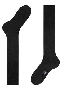 Schwarze Socken aus einem weichen, strukturierten Material mit einem vollen Bein und einer abgerundeten Zehe. Zeigen dezente Markenkennzeichnung am Fuß.