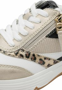 Sport sneaker with a mix of white, gold, and leopard-patterned materials. Features textured fabric, shiny accents, and flat laces.