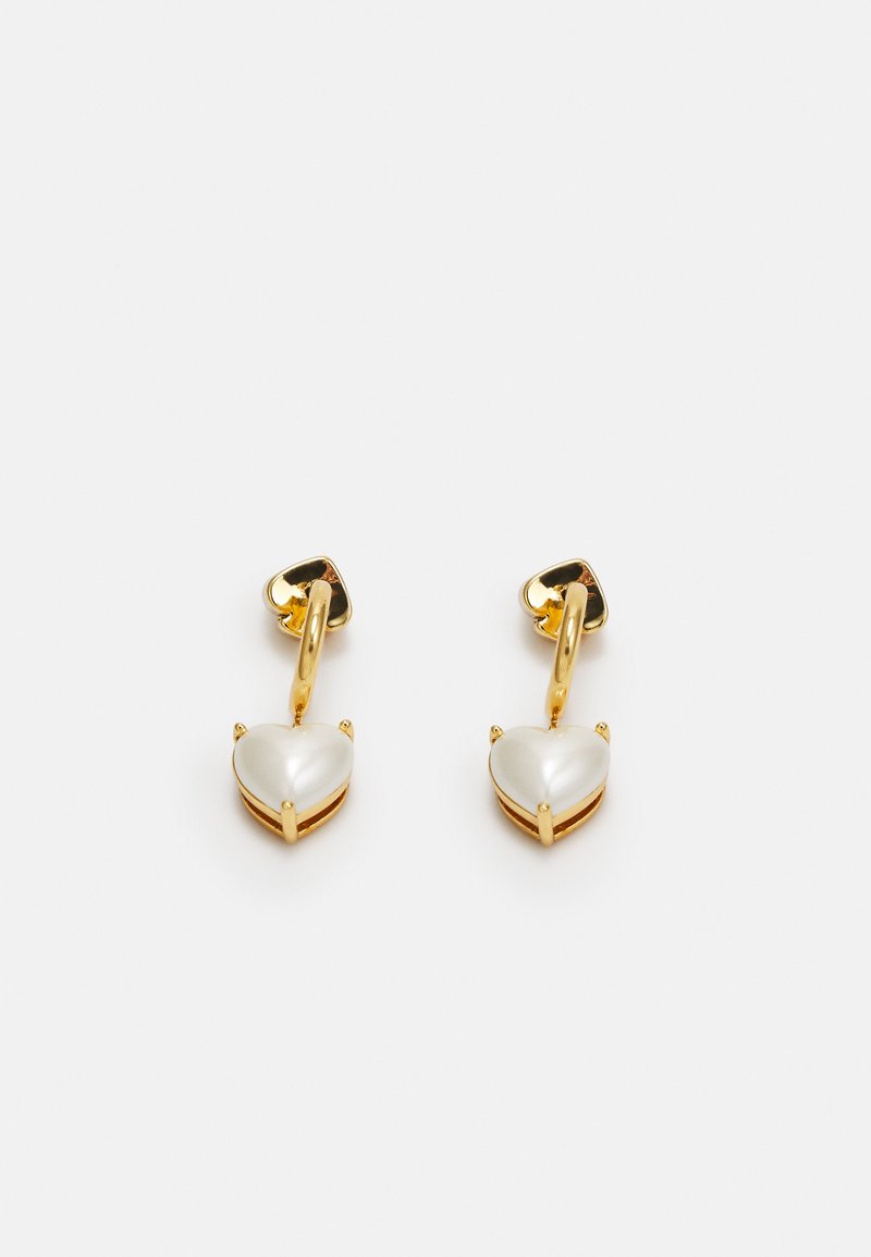 Gold-tone heart-shaped earrings with a smooth, pearl-like finish, featuring a secure backing and decorative prongs at the edges.