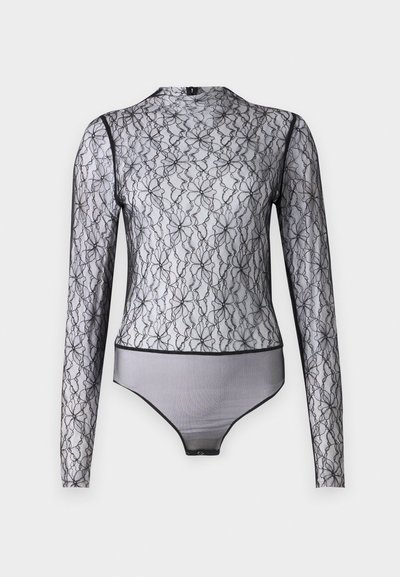 Μαύρο κορμάκι με μακριά μανίκια σε διάφανο δαντέλα με λουλουδάτα μοτίβα. Διαθέτει ψηλό λαιμό και αντίθετη μαύρη επένδυση στις άκρες και το στρίφωμα.