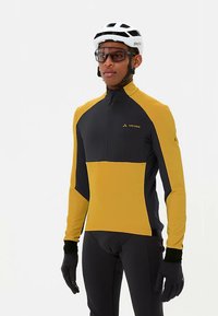 Fietsshirt met lange mouwen in zwart en mosterdgeel, voorzien van een kwart rits, een aansluitende pasvorm en reflecterende logo-accenten.