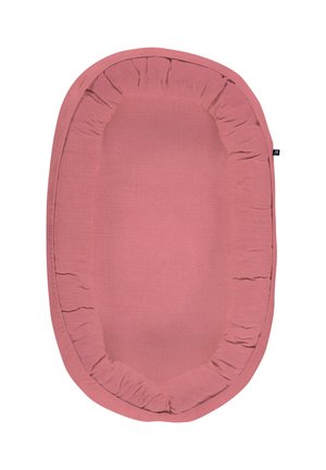 Oval pink baby nest with gathered fabric edges and a small black tag on the right side.