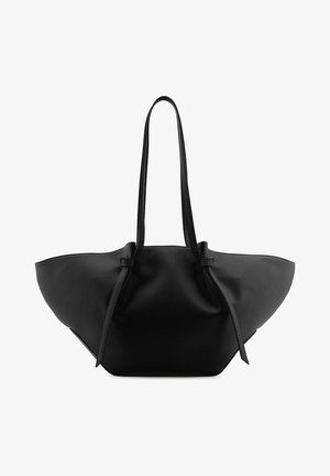 Sac à main en cuir noir avec des côtés larges et évasés et deux longues bandoulières nouées près du haut.