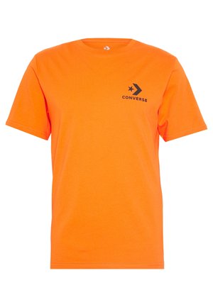 Kortærmet T-shirt i levende orange bomuld. Har et sort "Converse"-logo med en stjerne- og pil-design på brystet.