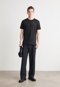 Calvin Klein Jeans REGULAR FIT TEE WITH BOLD BACK PRINT - T-shirt con stampa - black
