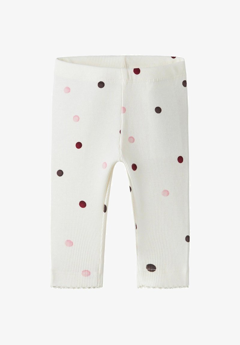 Leggings bébé blancs côtelés avec des pois roses, bordeaux et marron et ourlets festonnés aux chevilles.