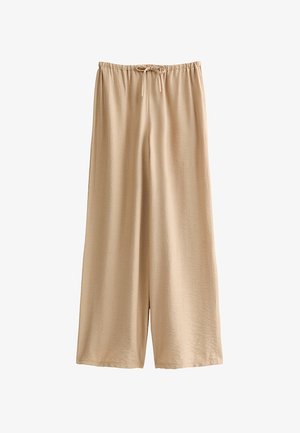Pantalon large couleur nude en tissu doux et léger, doté d'une taille élastique avec cordon de serrage et une coupe décontractée.