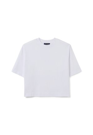 Witte gecropte T-shirt van katoen. Het heeft korte mouwen, een ronde halslijn en een minimalistisch ontwerp zonder patronen of versieringen.