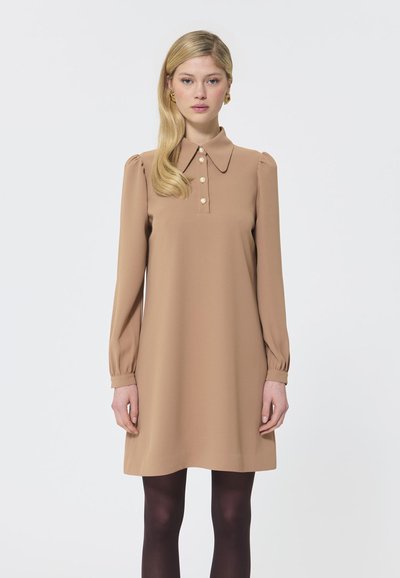 Beige, long-sleeve dress with a collared neckline, front button placket, and puffed shoulders. Smooth texture with a relaxed fit.