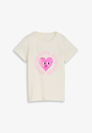 Cream short-sleeve T-shirt with a pink sequined heart showing eyes and smile, surrounded by pink text reading "AMAZING DAYS WITH LOVE."