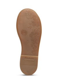 Suola di scarpa in gomma marrone con motivi floreali e scanalature testurizzate per aderenza. Presenta un piccolo logo e un numero all'interno di un cerchio.