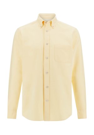Chemise à manches longues en tissu jaune clair avec un col boutonné, un patte de boutonnage à l'avant et une poche sur la poitrine. Texture lisse avec une couleur unie.