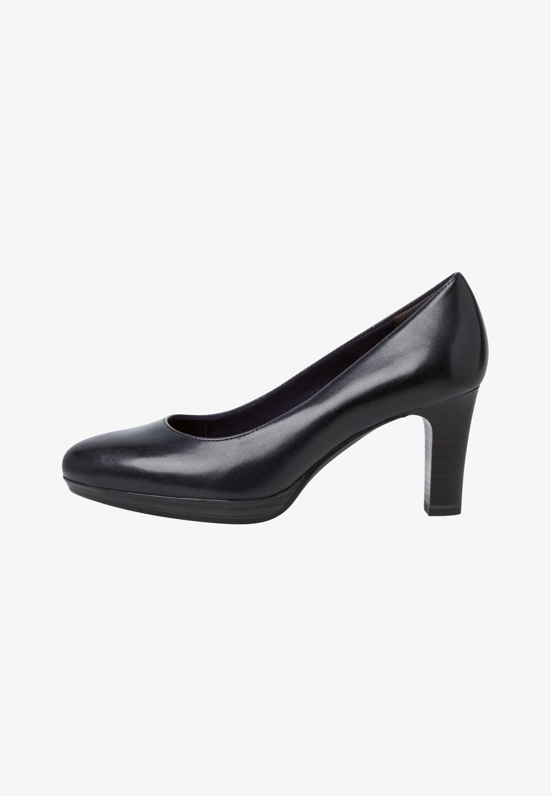 Chaussure habillée en cuir noir avec un bout rond, une légère découpe au niveau du cou-de-pied et un talon bloc stable de hauteur moyenne. Surface lisse avec une finition brillante.