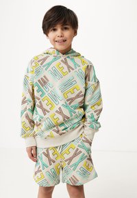 Set mikiny s kapucí a šortkami v béžové barvě, zdobené vícolorovými geometrickými textovými vzory v mátové, žluté a hnědé. Měkká látka.