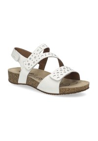 White leather sandals with perforated accents, cross straps, and cork-like sole. Features adjustable straps and a cushioned footbed.
