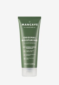Mørk grønn plasttube, 100 ml, merket "MANCAVE ORIGINAL MOISTURISER". Har hvit tekst, glatt tekstur og en gjennomsiktig bunn.