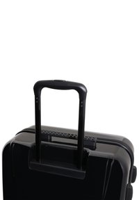 Black hard-shell suitcase with two extendable black handles and a textured grip. Zippered closure and smooth, glossy surface.