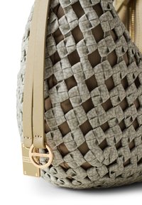 Woven gray bag with a smooth textured surface, featuring beige straps and a gold hardware accent. The interior is lined in a darker fabric.