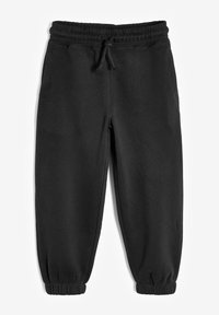 Schwarze Freizeithosen aus weichem Material, mit elastischem Bund, verstellbarem Kordelzug und schmal zulaufenden Bündchen.