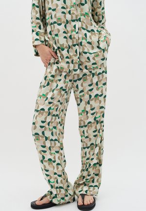 Patterned loungewear set in soft fabric. Features a beige base with green, brown, and cream geometric shapes. Includes a button-up top and loose pants.