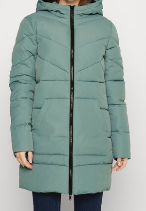 Long puffer coat in muted teal, featuring a hood, vertical and horizontal quilted design, black zipper, and two front pockets.