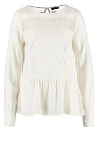 Blouse blanche à manches longues avec détails en dentelle sur la poitrine, ourlet péplum froncé, col rond et fermeture à bouton avec ouverture en forme de goutte au dos.