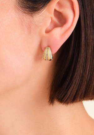 Gold-tone ear studs with a three-part design, featuring a textured surface and scattered clear rhinestones for added detail.