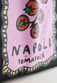 Black bag featuring a pink graphic of tomatoes and the text "NAPOLI TOMATOES," bordered with yellow and black accents. Smooth texture.