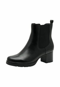 Bottines noires en cuir avec des panneaux élastiques sur les côtés, bout arrondi et un large talon bloc. Texture lisse avec une languette à l'arrière.