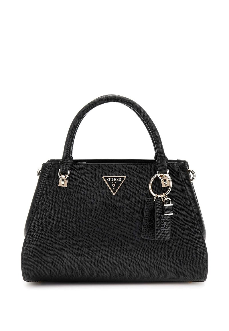 Black synthetic handbag with a structured shape, featuring a triangular logo, metal hardware, and hanging tags. Smooth texture, short handles.