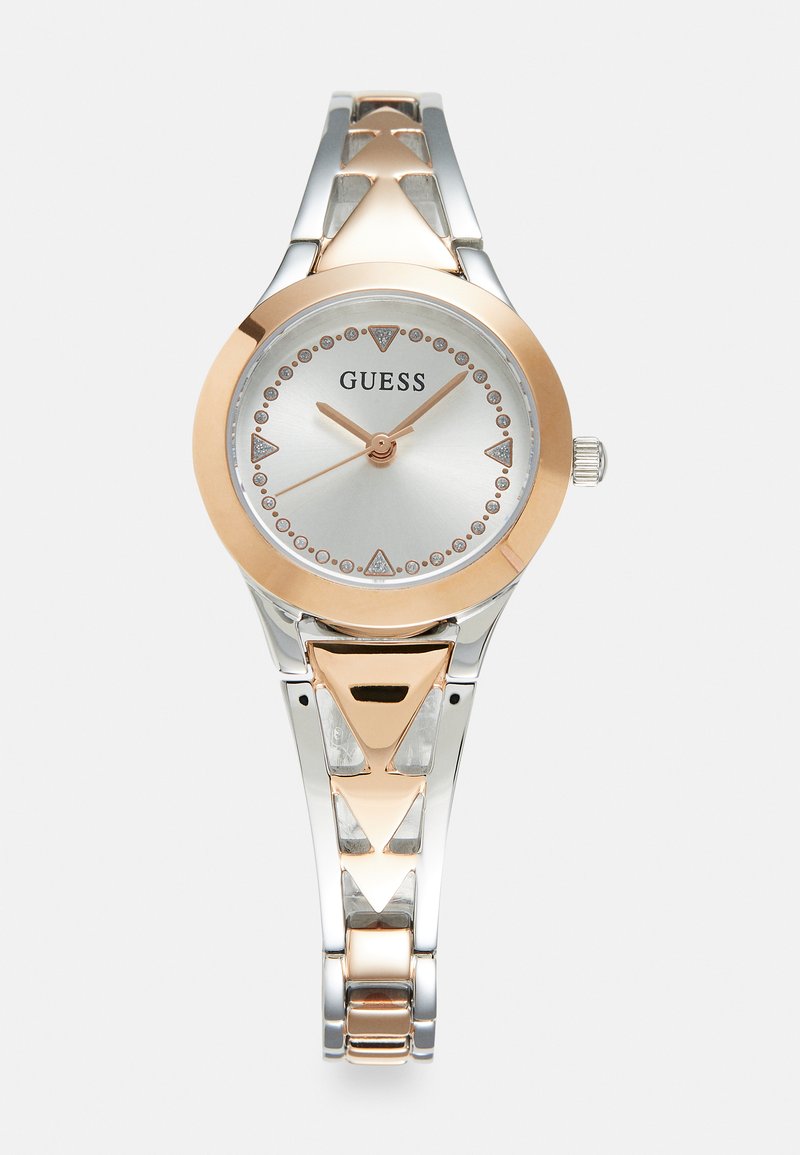 Silbernes und roségoldenes Armband mit rundem Zifferblatt, metallischem Armband mit dreieckigen Akzenten und kristallbesetzten Stundenmarkierungen.