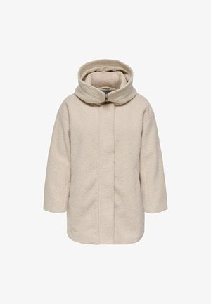 Cremefarvet uldfrakke med en tekstureret overflade, høj krave og lynlås foran. Har brede ærmer og en lige silhuet.