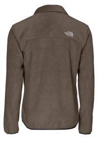 Brązowa polarowa kurtka z długimi rękawami, zaokrąglonym kołnierzem i logo The North Face w kolorze szarym; gładka tekstura o prostym kroju.