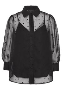 Zwarte doorschijnende blouse met lange opgezette mouwen, kleine geborduurde hartjes, knoopsluiting aan de voorkant en een ingebouwde zwarte top eronder.
