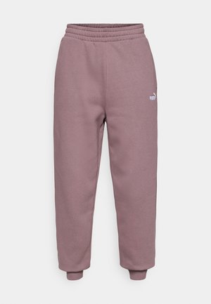 Pantalon en tissu léger et doux de couleur violet clair, avec une taille élastique, des poignets effilés et un petit logo blanc sur la jambe gauche.