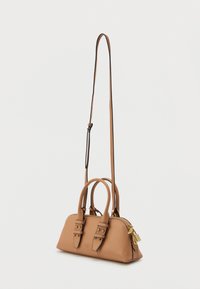 Tan leather handbag with dual handles, detachable shoulder strap, zip closure, gold-tone hardware, and decorative lock detail.
