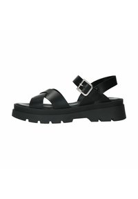 Black leather sandal with crisscross straps, adjustable ankle buckle, and thick, textured rubber sole. Features a lugged outsole for grip.