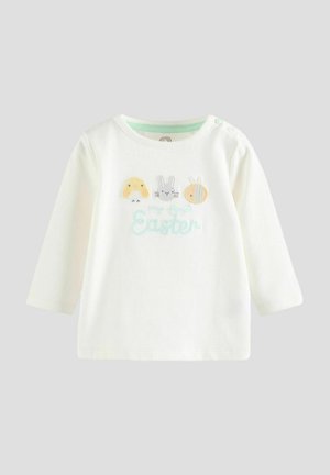 White long-sleeve shirt featuring embroidered chick, bunny, and egg designs with pastel accents and "my first Easter" text in blue.