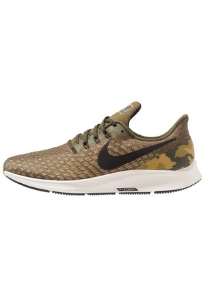Olive green and brown Nike running shoe with black swoosh, white sole, mesh upper, and camouflage pattern on heel.